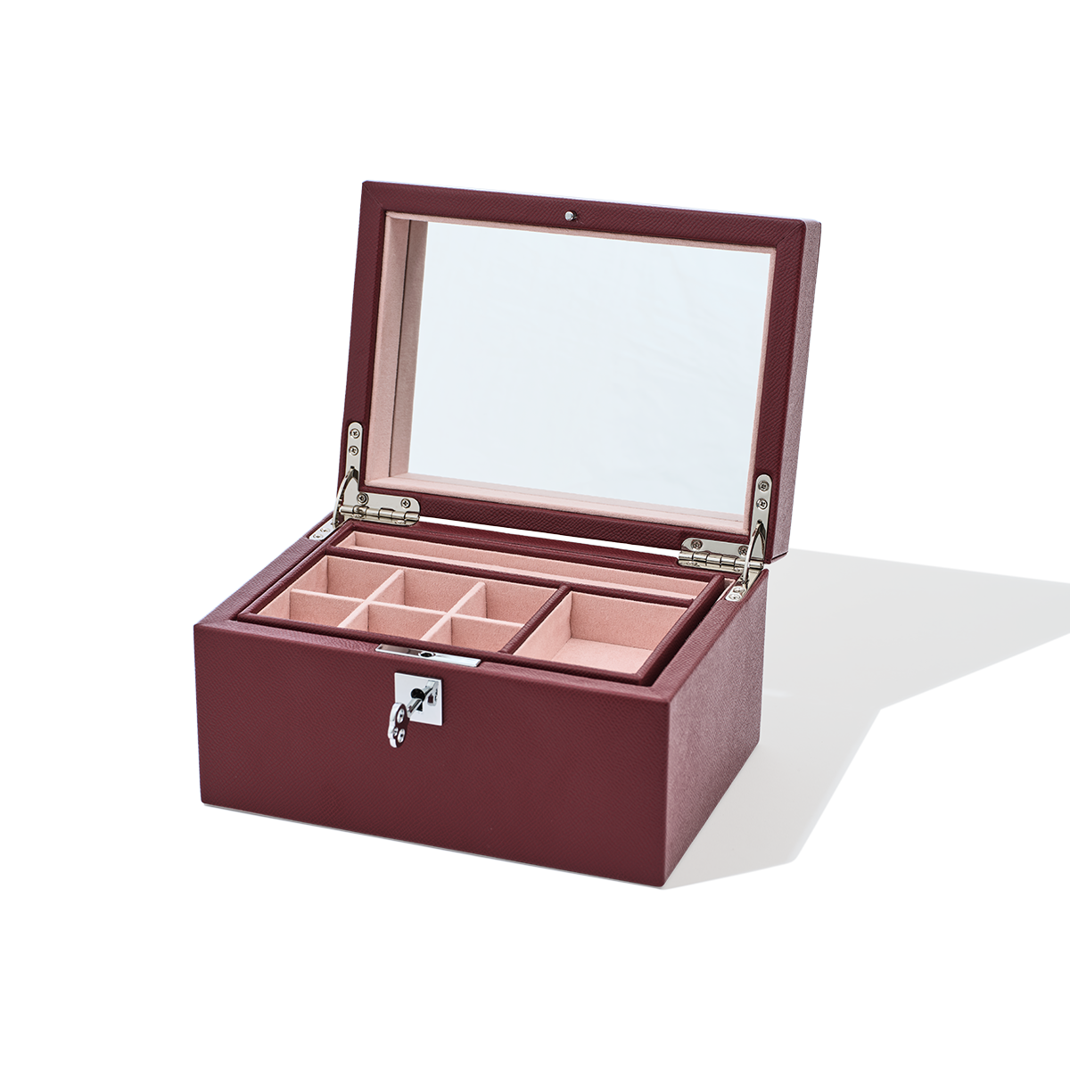Wooden jewelry box with glass lid on a white background